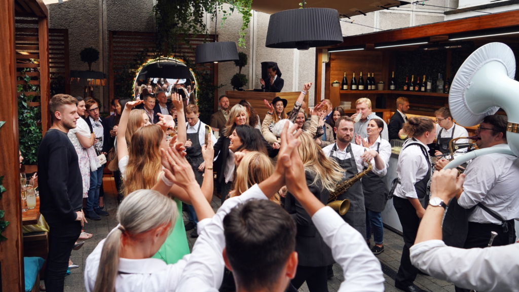 Guests dancing and enjoying live music at a Courtyard Session at The West Park Hotel in Harrogate.